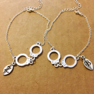 Two partners in crime silver leaf letter bracelet