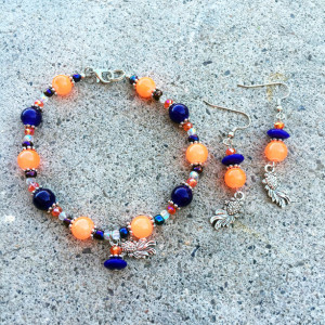 Fluorescent orange, blue/purple and silver-toned coy charm bracelet and earrings