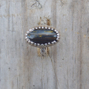Handcrafted sterling ring set with tigeriron cabochon. 