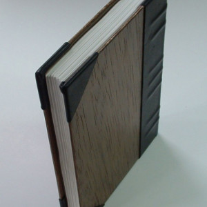 Handmade book bound in leather and wood