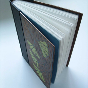 Handmade book, bound in leather and wood, original block-print cover art.