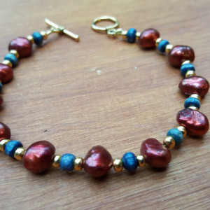 Rich burgundy, gold and navy blue beads bracelet, golden color clasp and wire