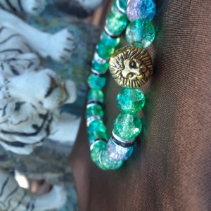 Green colored lion charmed braclet