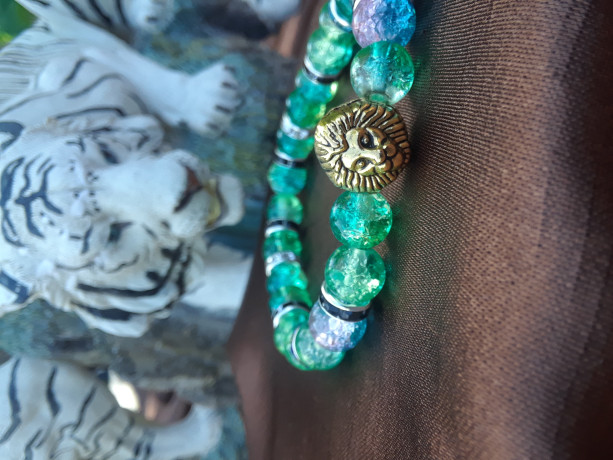 Green colored lion charmed braclet