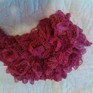 Dark pink knitted scarf