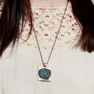 Hand-stamped copper pendant with light blue leaf imprint