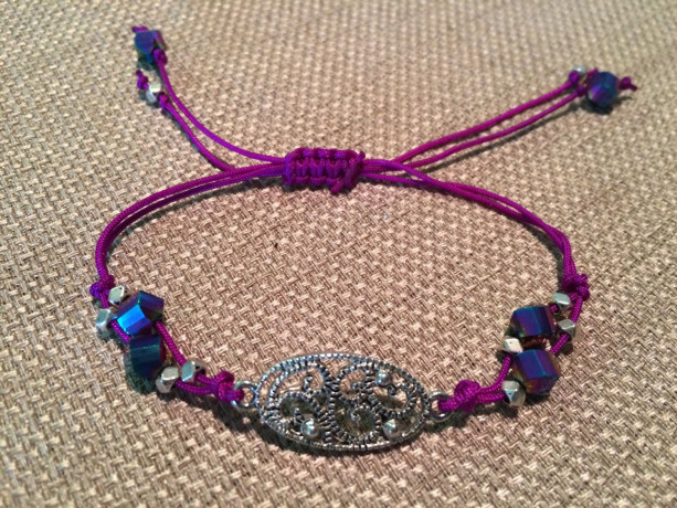 Handmade adjustable bracelet with purple cord and multicolor beads