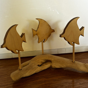 Wooden fish on driftwood