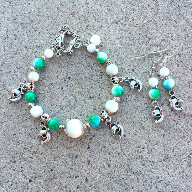 Dolphin charm and marbled glass bracelet with silver charm earrings