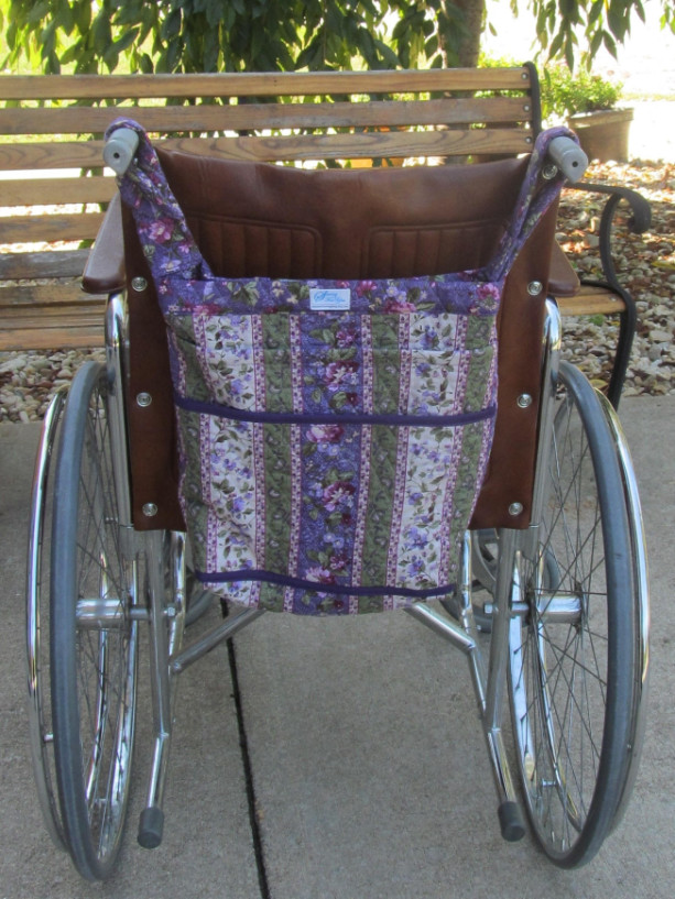 Wheel Chair Bag, in purple floral, with 2 outside pockets, loops to go over chair handles