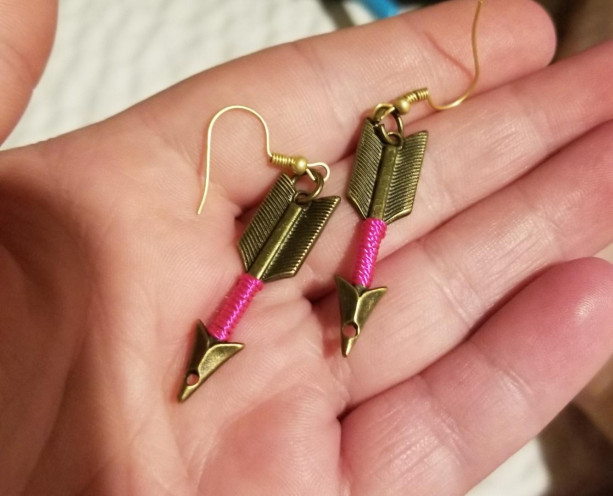 Gold arrow hook earrings with pink around arrow