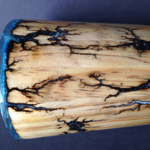 Wood vase with fractal Burns filled with blue pigment 