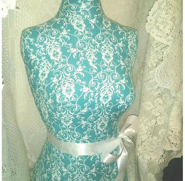 Decorative Dress form designs with stand, life size torso great for store front display or home decor. Teal scroll print.