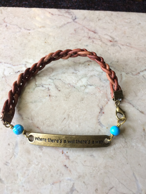 Brown braided leather bracelet with bronze tone plate connector said "Where there's a will there's a way"& turquoise beads.# B00245