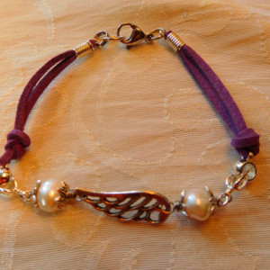 Natural purple leather and silver tone angel wings bracelet and earrings matching set design.  #BES00121