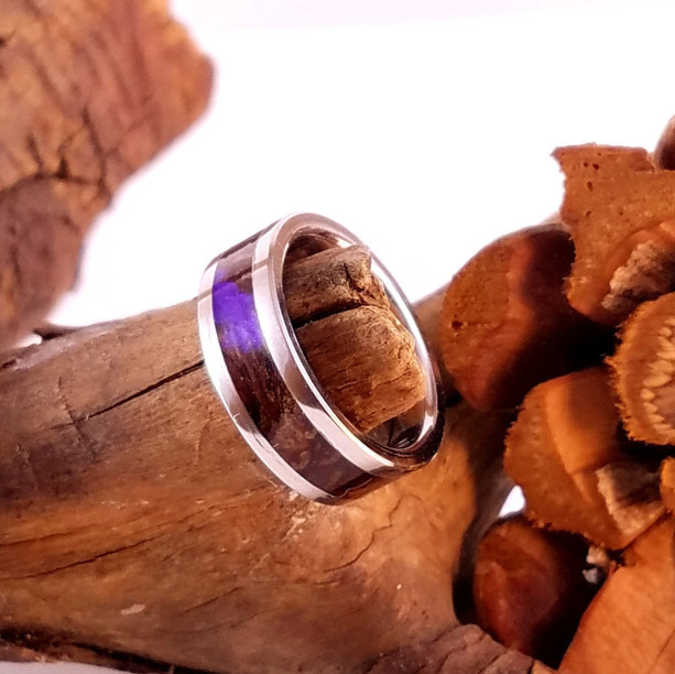 size 4 stainless steel and pinecone ring, stainless steel core and edge trim, pinecone wood, lavender resin. 6mm band