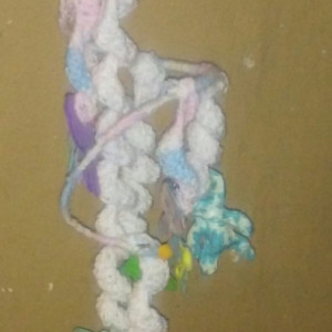 Crocheted mobile with felt babies attached.