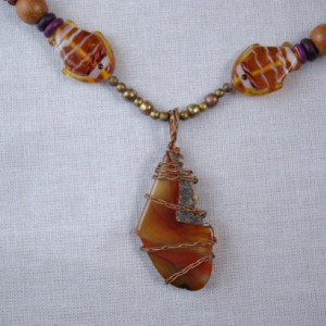 Fishing for agate:  Ingredients are an agate focal stone, beads of all sorts and a few fish.