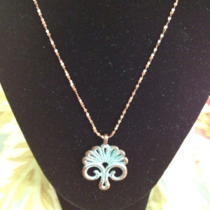 Hand rubbed copper patina floral pendant on a gorgeous sparkly chain.