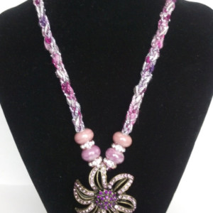 Flower pendant on a hand-knitted cord! Toggle closure, premium glass bead accents, and jeweled accent beads!