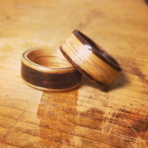 His and hers opposites Oak and Rosewood inlayed wedding band set