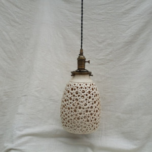 Hand Crafted Stoneware Pottery Hanging Pendant Ceiling Light with Hand Carved cut circles. Are you remodeling? Or maybe have a restaurant?