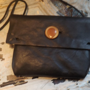 Perfect little black Bag for the girl on the go. Vintage Button, Black leather with cute plaid lining