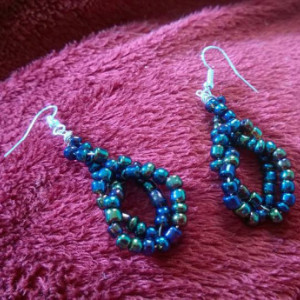 Twisted iradescent blue beaded earrings