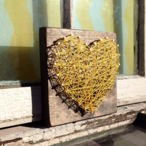 Nail and String Art Heart in Yellow on Stained Wood