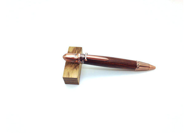 Hand turned Knights Armor pen with copper finish featuring Cocobolo