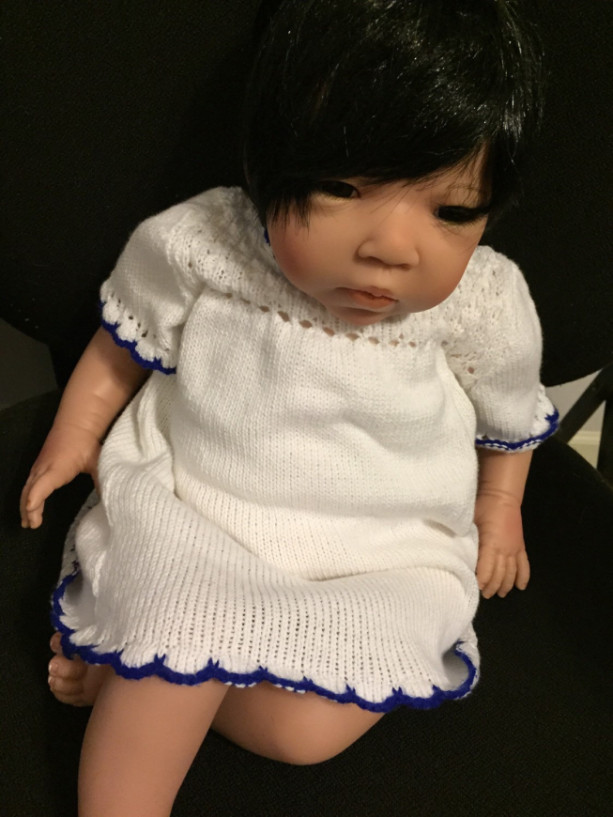 Sweet little white cotton dress for baby