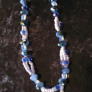 Bluish green glass beads with small blue and white glass beads, 8 inches long with 3 inch silver chain connector and matching earrings.