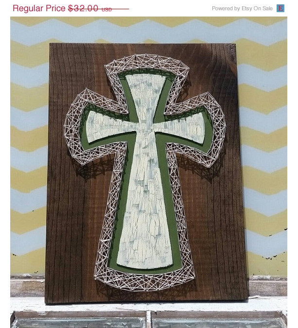 SALE String Art Cross. Green and Cream Paint outlined in Cream colored String Art. On Dark Walnut Stained Wood. Handmade by Nailed It Design
