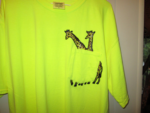 Fluorescent yellow tshirt, hand painted w/ Giraffes running though pocket