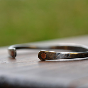Silver cuff bracelet with rivets
